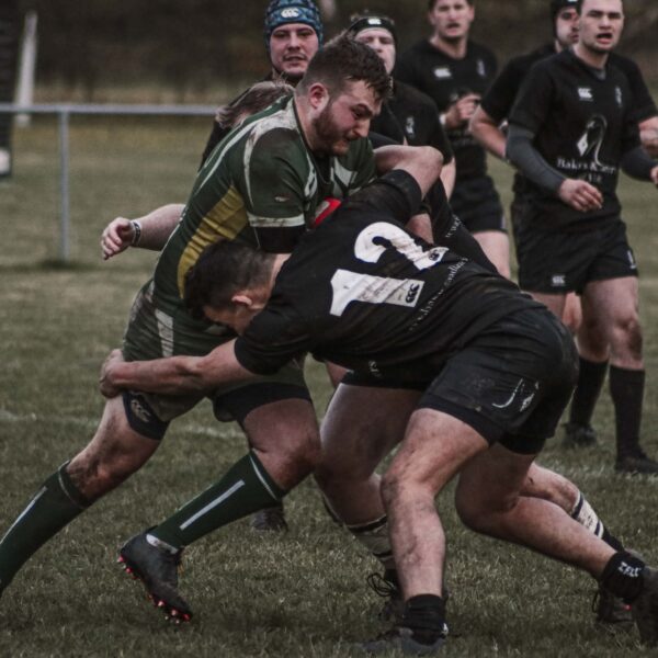 Men playing rugby