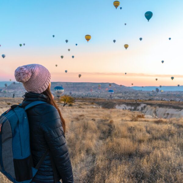 Woman watching hot air balloons